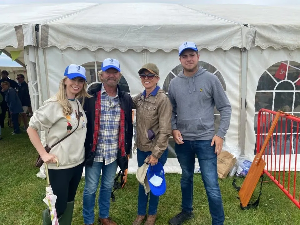 Beer Puppeteer IOM team and visitors at an outdoor event